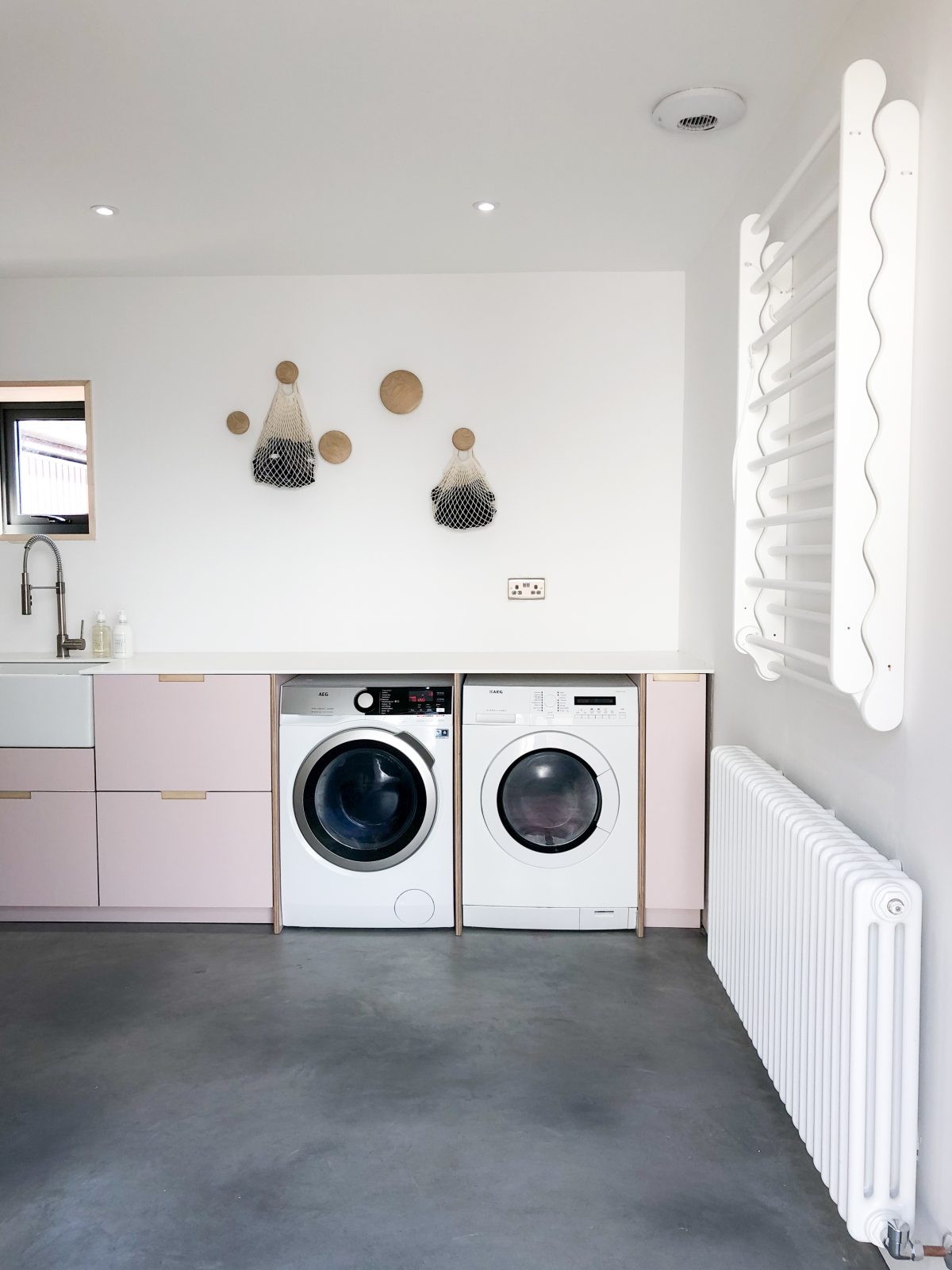 Pink utility room Great Space Architects